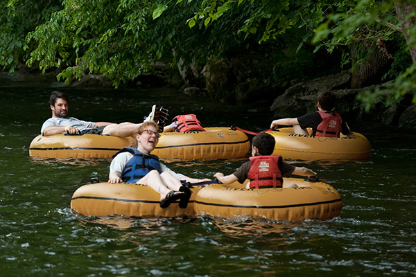 A family tubing down a river in Townsend, TN.